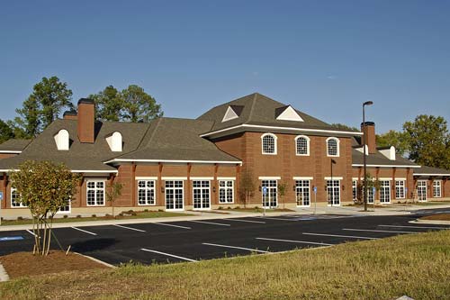 Parking lot view of commerical building.